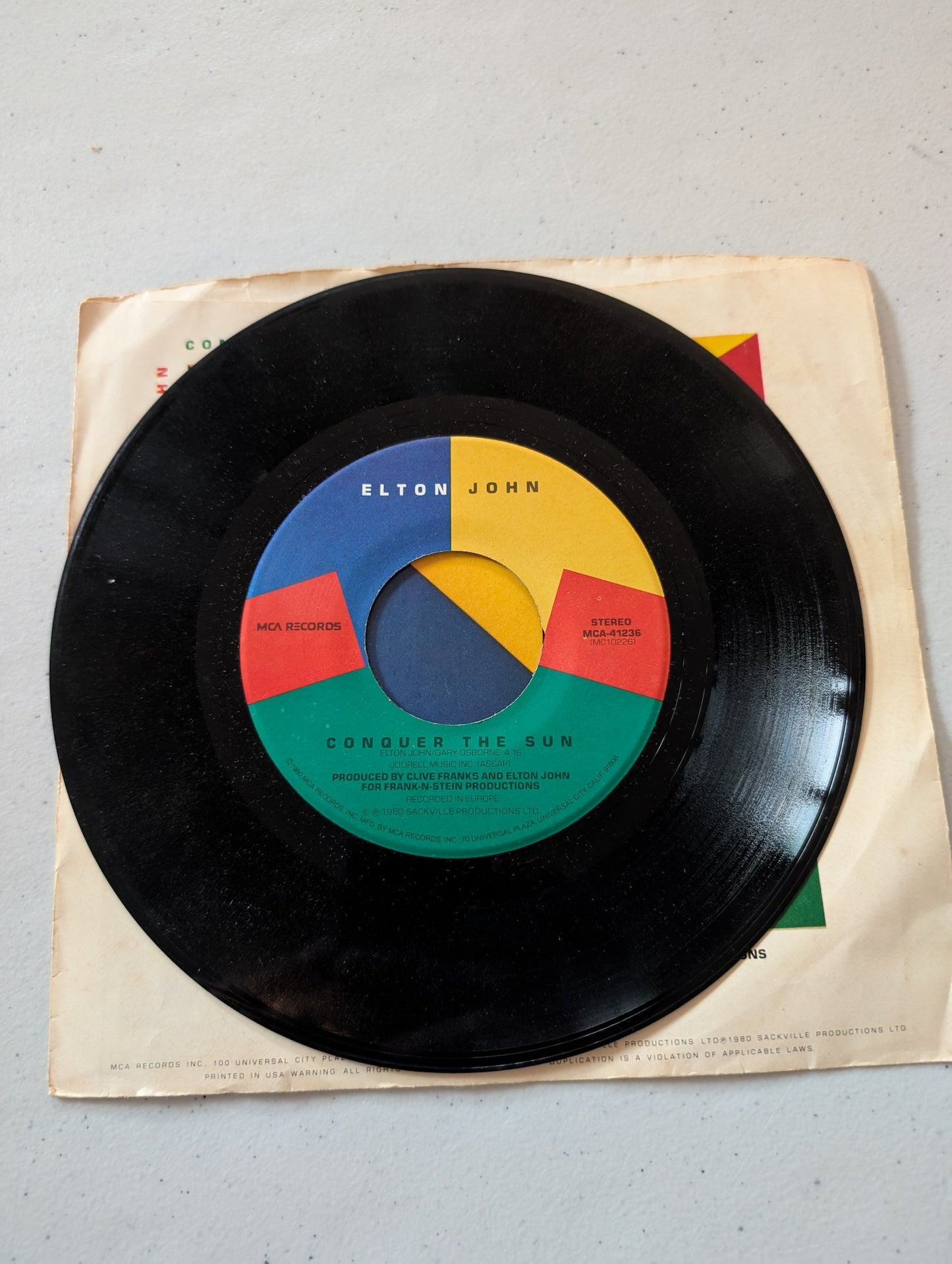 Elton John - Little Jeannie - Conquer The Sun MCA Records MCA-41236 1980 (7 in, 45 RPM, Single, Vinyl Record Album)