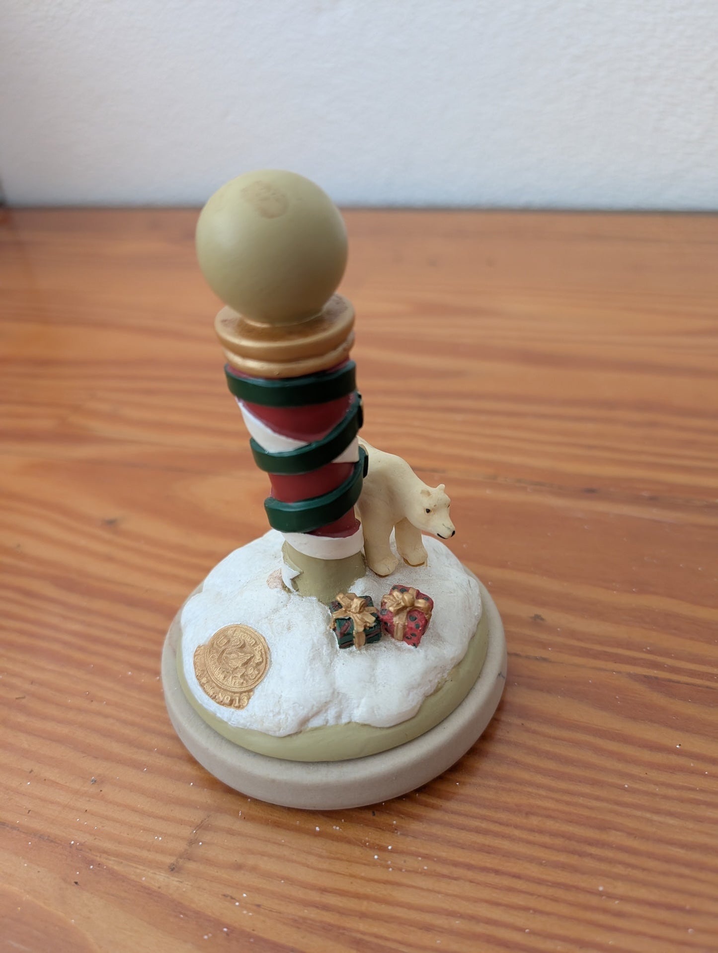 North Pole Figurine from Unknown - Holiday Decor (Resin Figurine, Traditional, Whimsical, Cream, Red, Green, Gold)