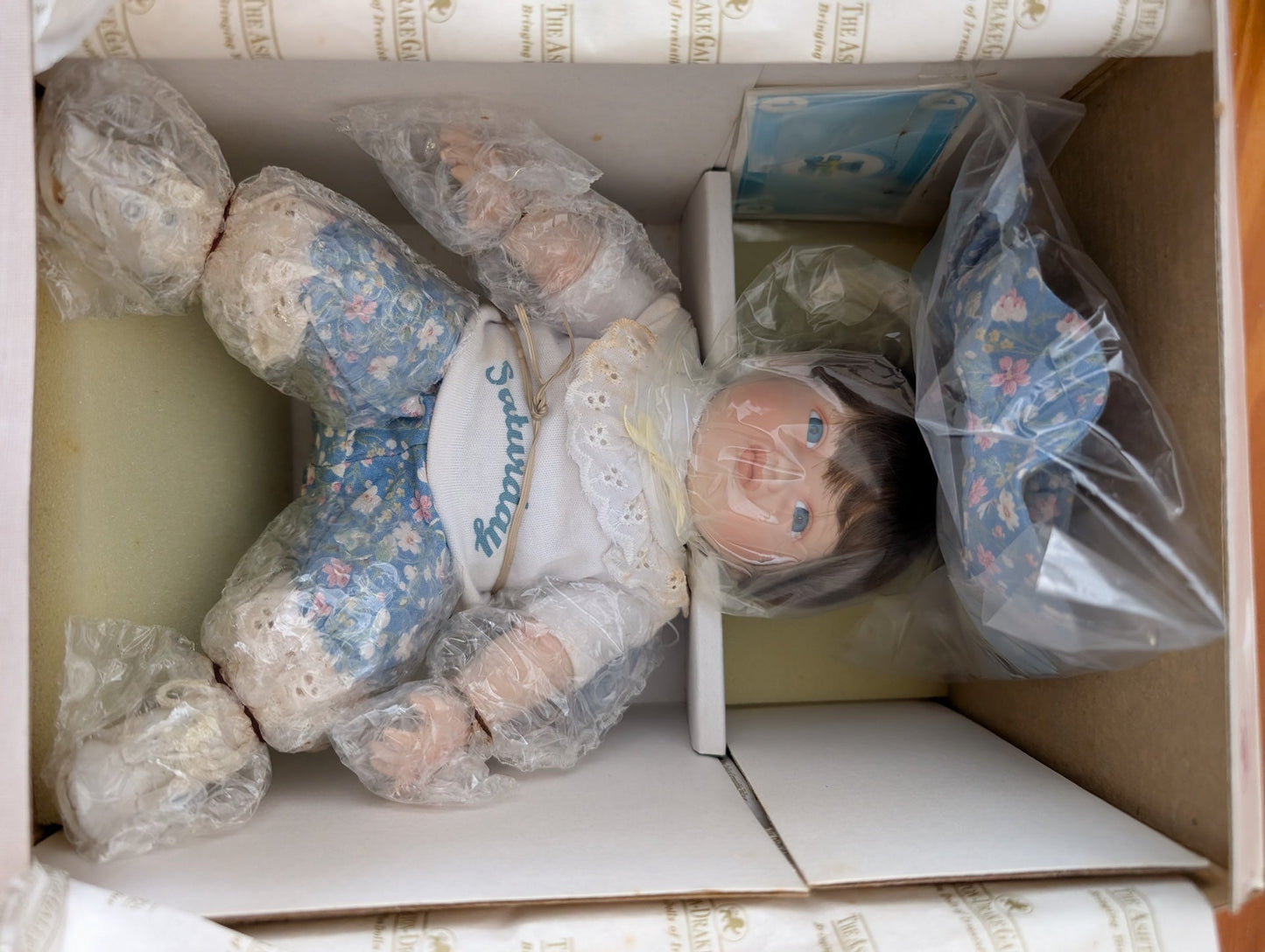 Saturday's Child (from Yolanda's Picture-Perfect Babies collection) from The Ashton-Drake Galleries - 1989 Dolls & Toys (Porcelain, Fabric Porcelain Doll, Vintage, Collectible, Nursery, Blue, White, Brown)