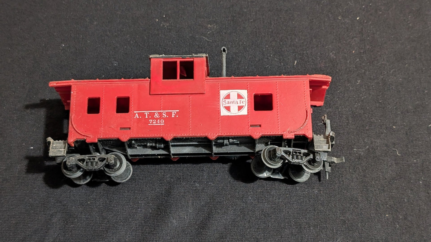 Santa Fe Caboose Caboose likely from Tyco/Life-Like - 1970s HO Scale Model Train (Plastic, Metal Caboose, Red, Black, White)