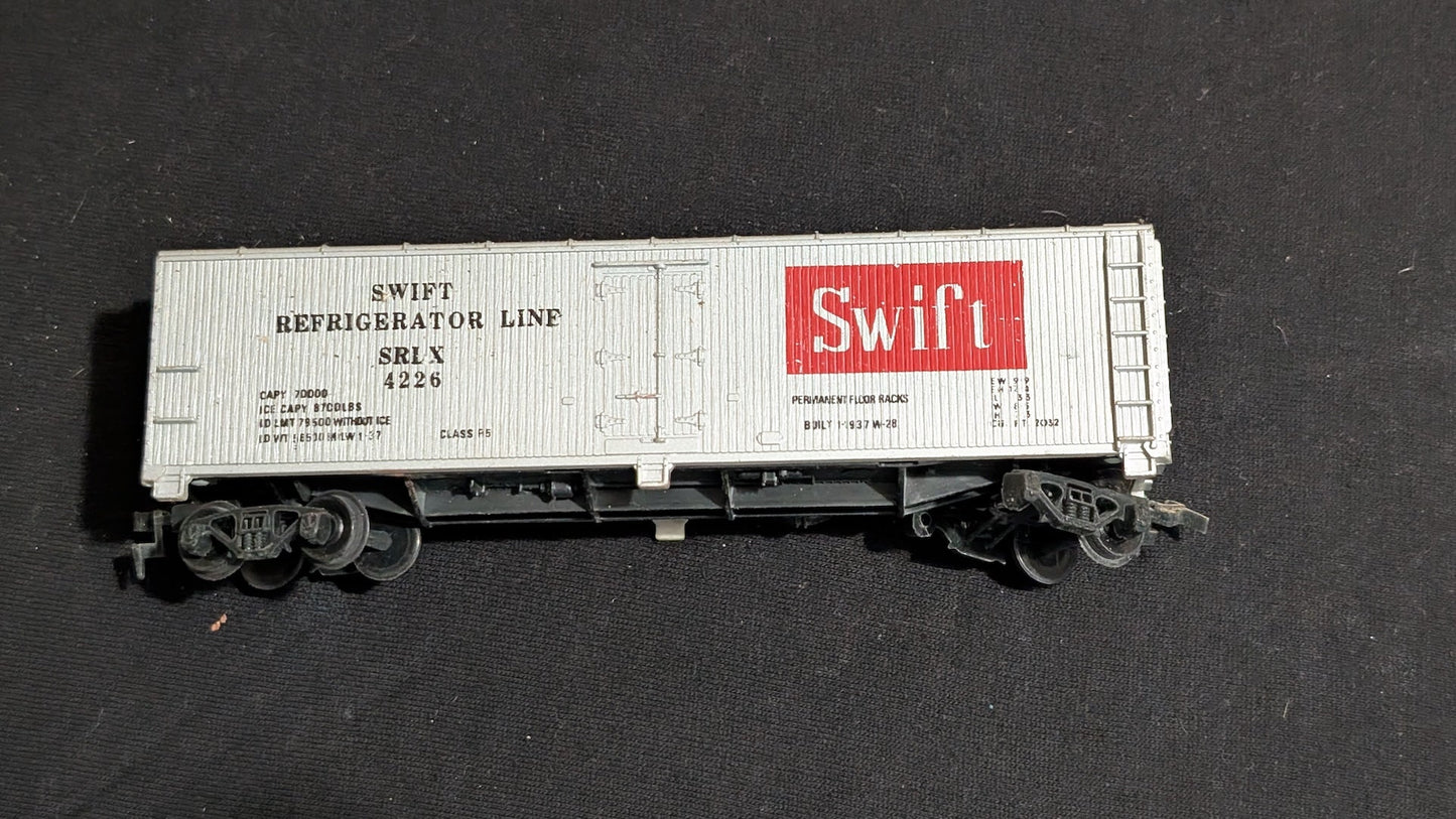 Swift Refrigerator Line Reefer Boxcar (Reefer) likely from Athearn - 1960s-1970s HO Scale Model Train (Plastic, Metal Boxcar (Reefer), Silver, Red, Black)