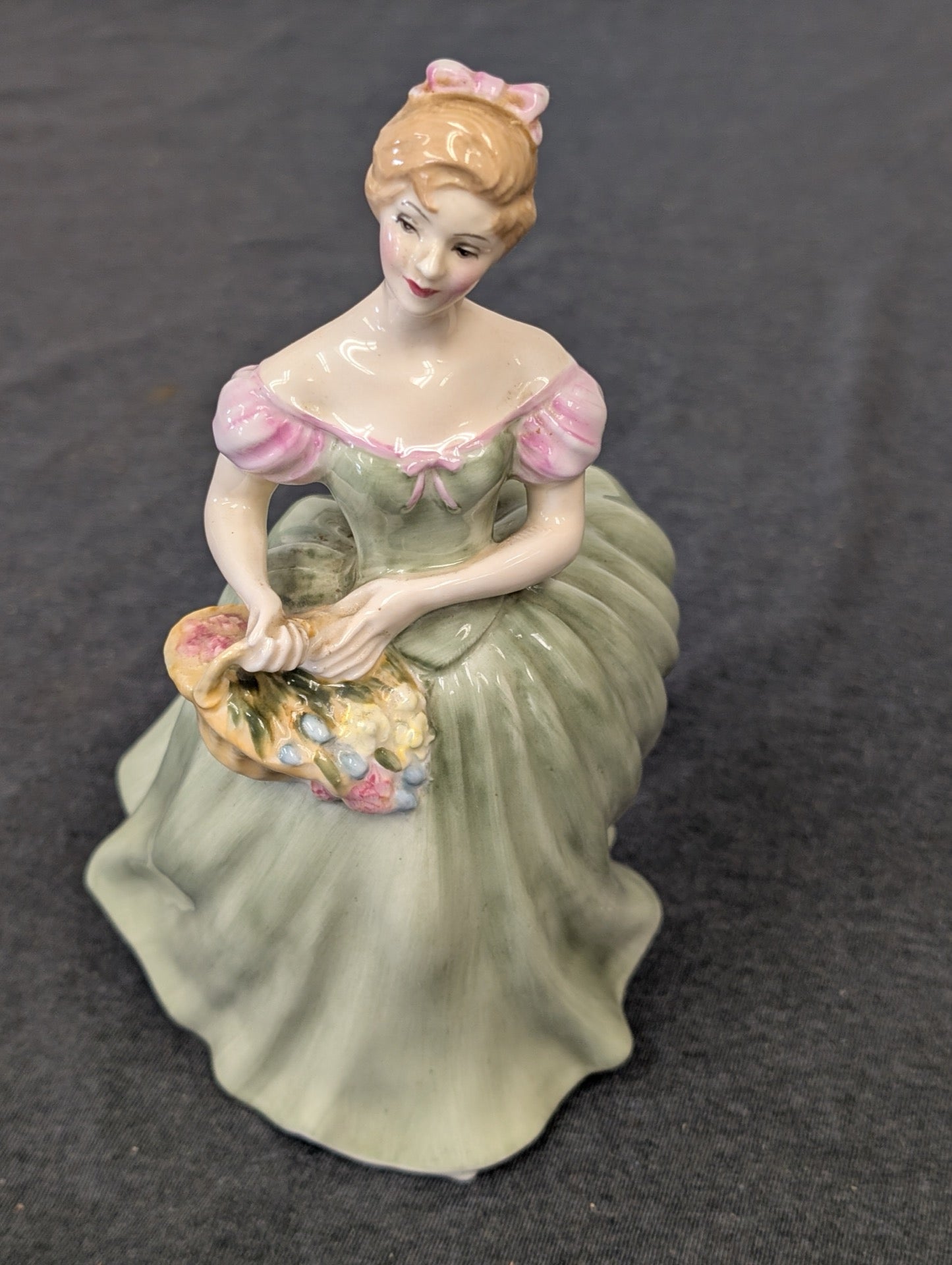 Royal Doulton Clarissa figurine in green dress holding flowers