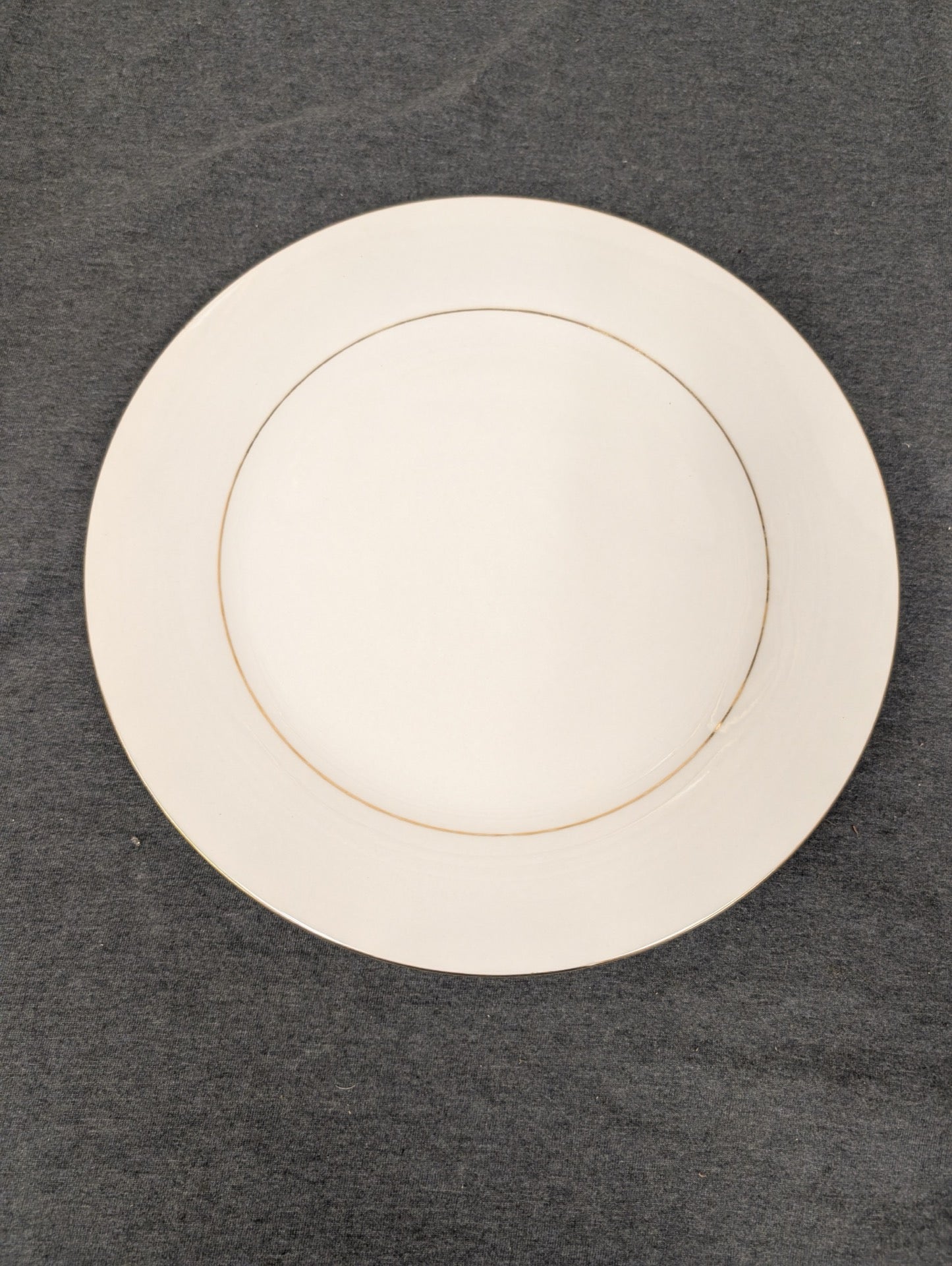 Minimalist view of the white and gold Sakura dinner plate.