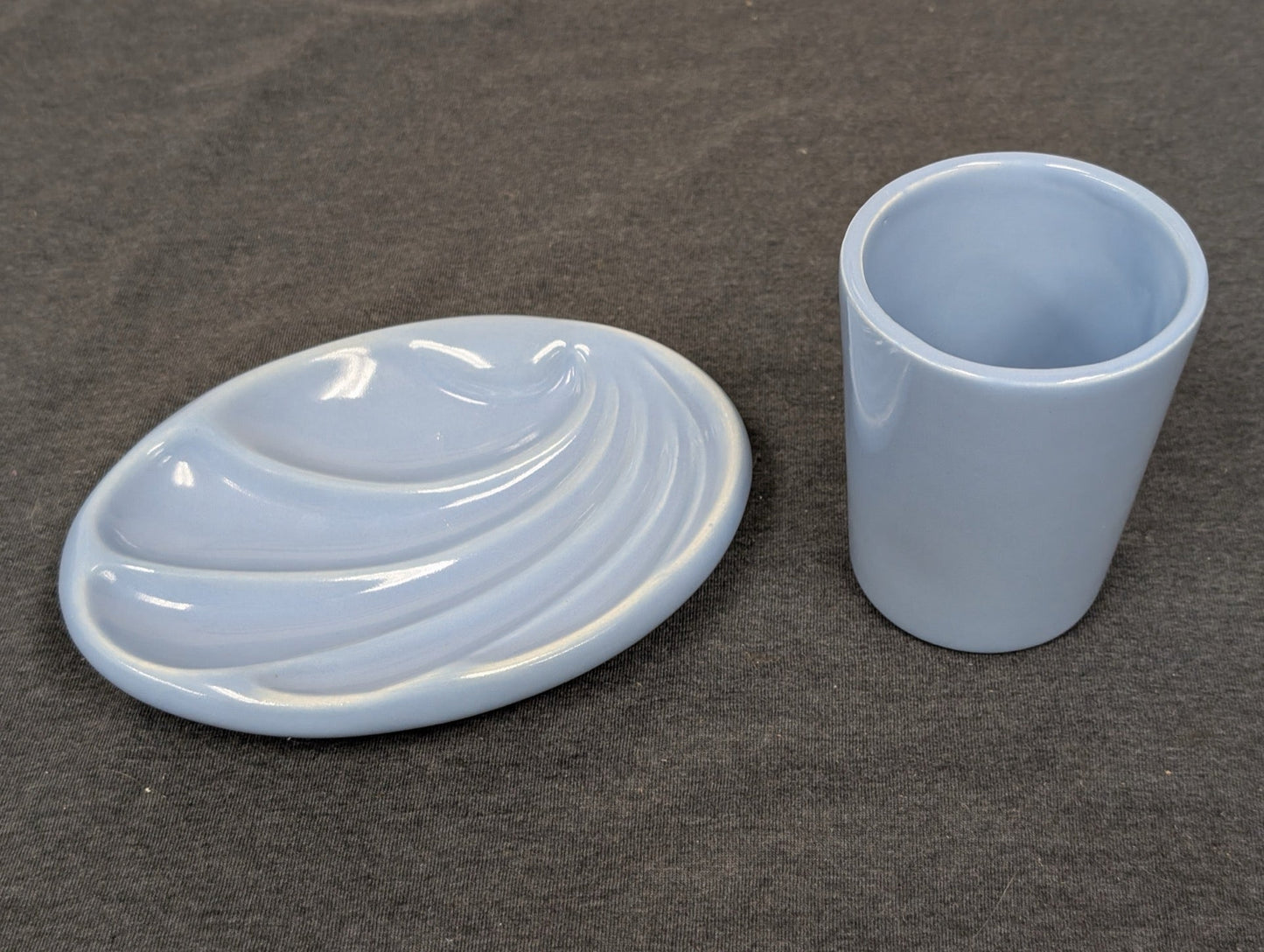 Light blue ceramic scalloped soap dish and matching tumbler.