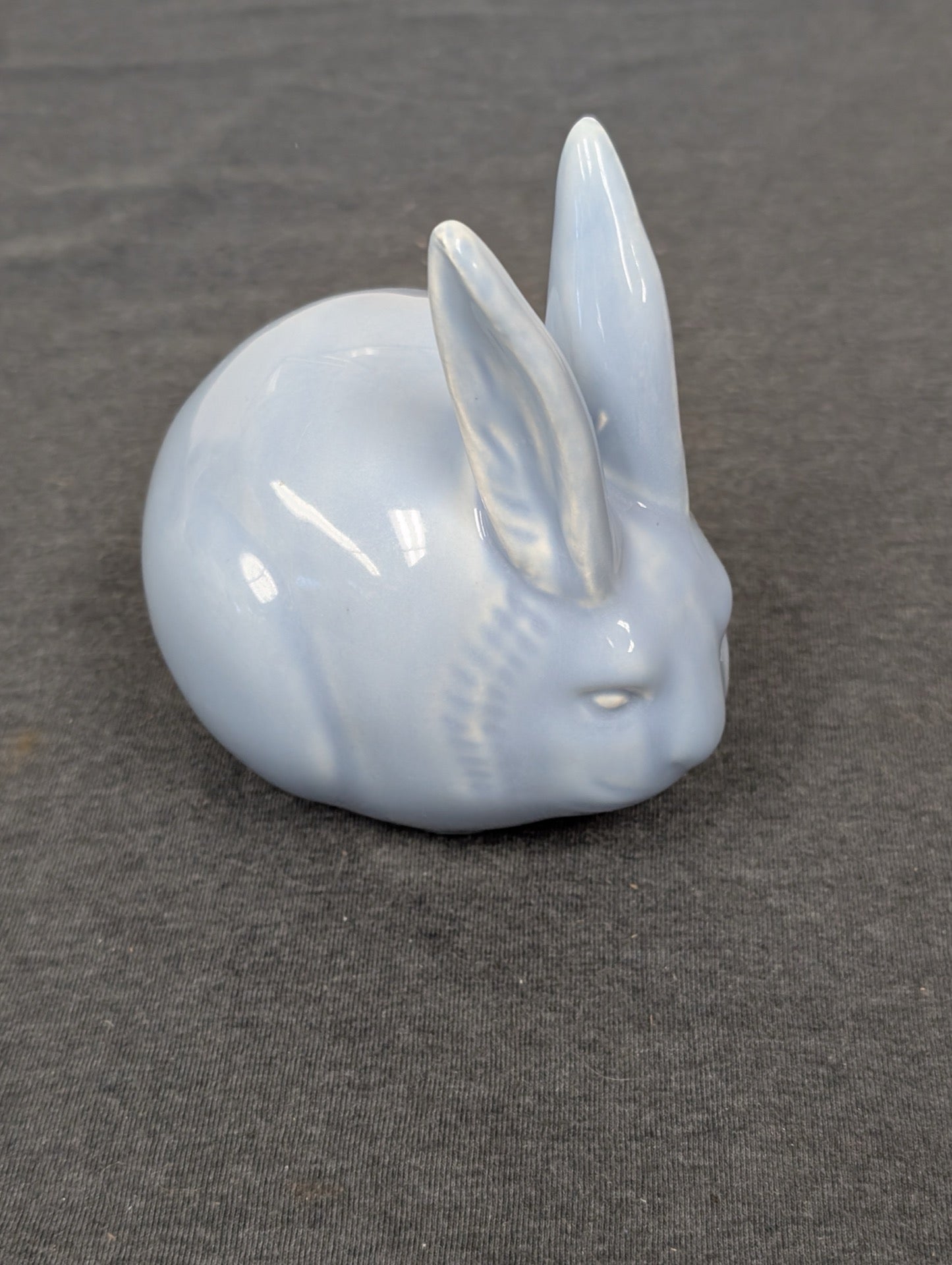 Light blue glazed ceramic bunny rabbit figurine sitting.