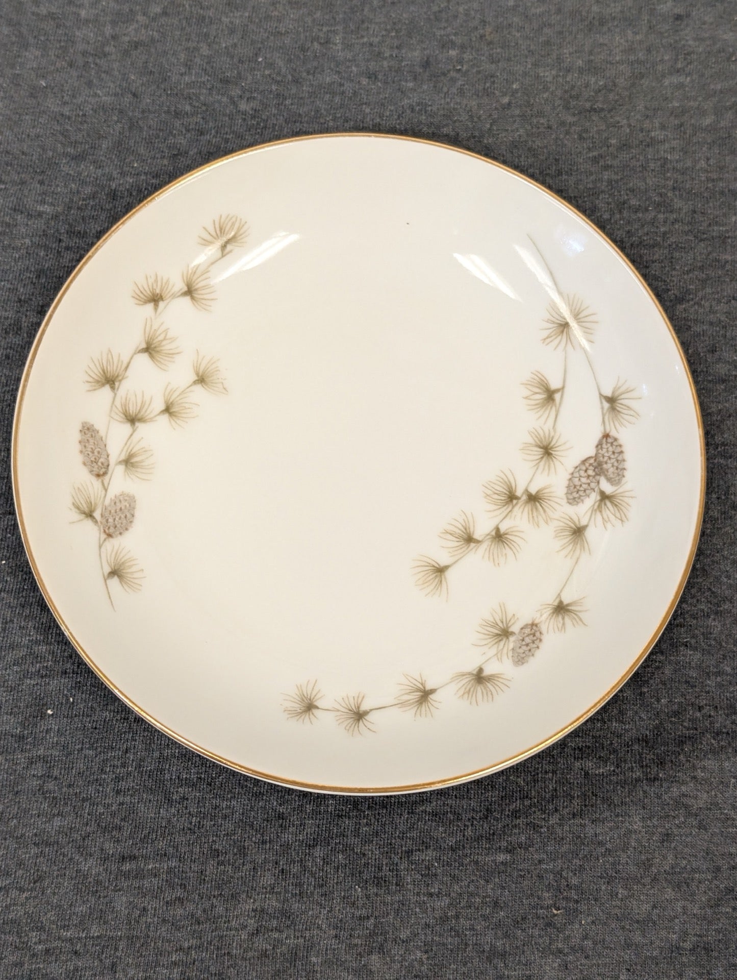 Front face of the Mikasa plate showing the evergreen pine needles.