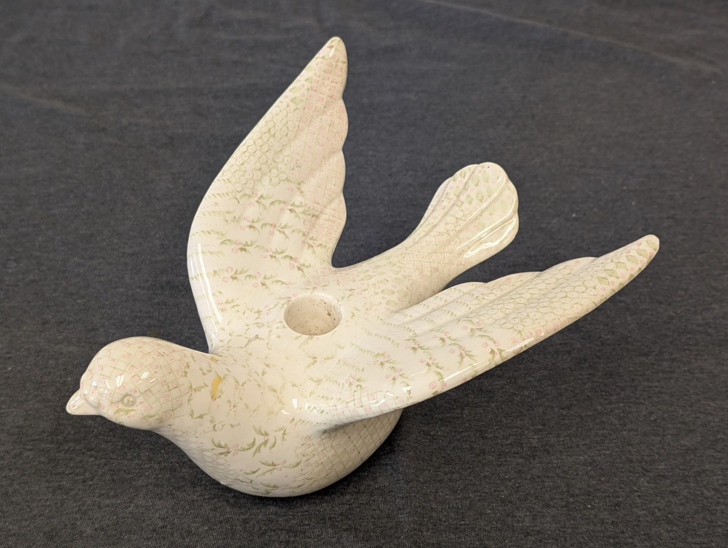 Ceramic dove figurine with pink and green floral pattern