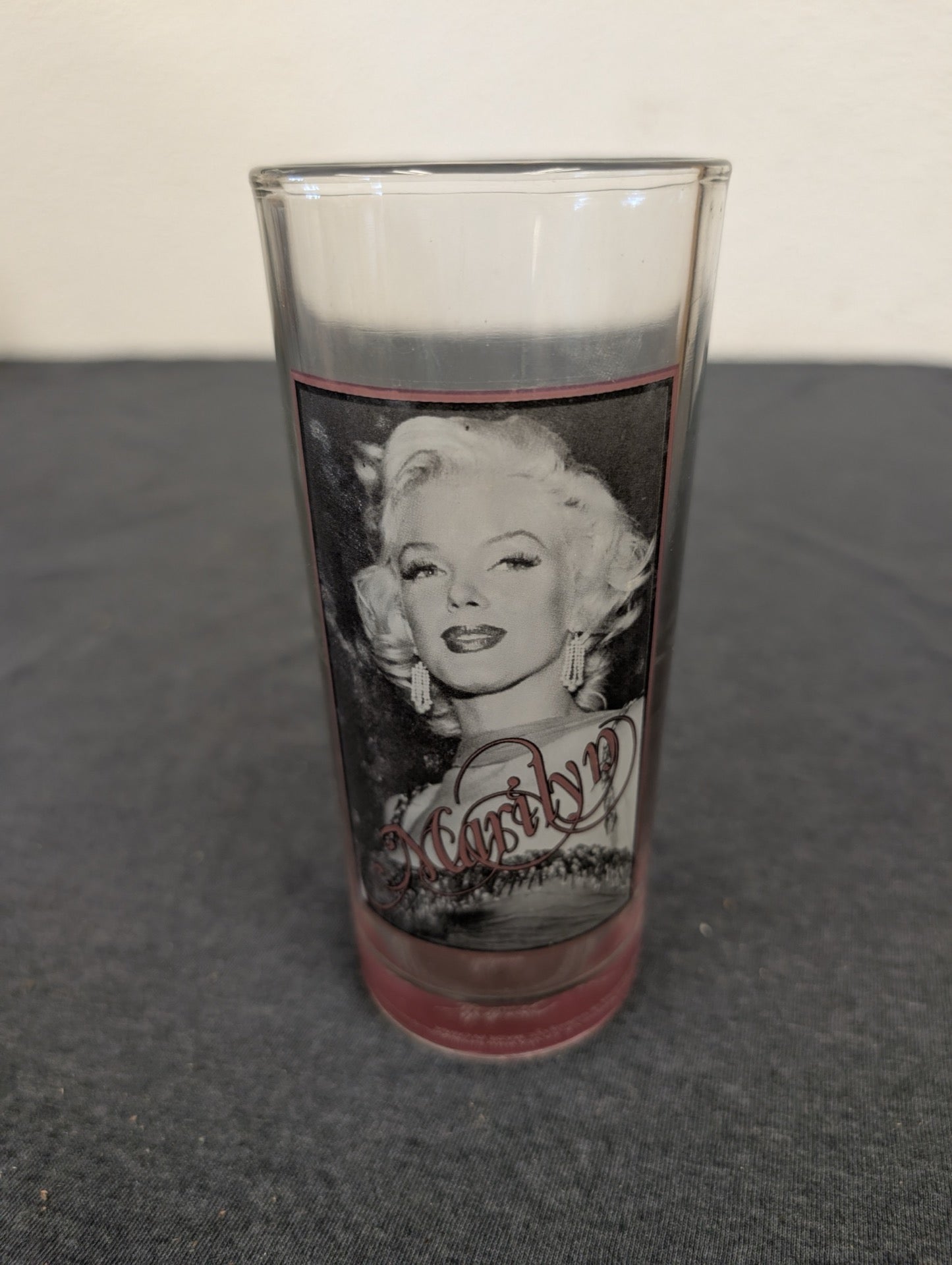 Glass tumbler showing a close-up portrait of Marilyn Monroe with a dark border