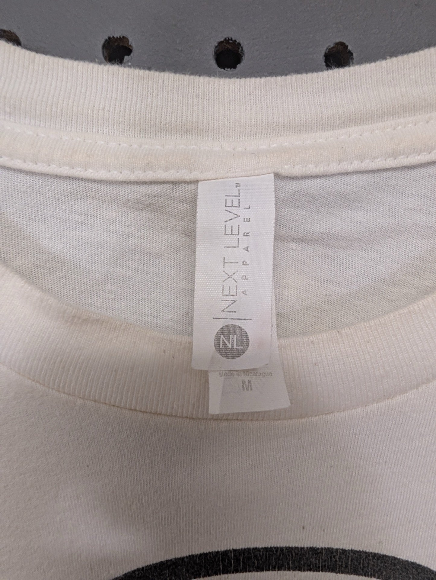 Next Level size medium tag
