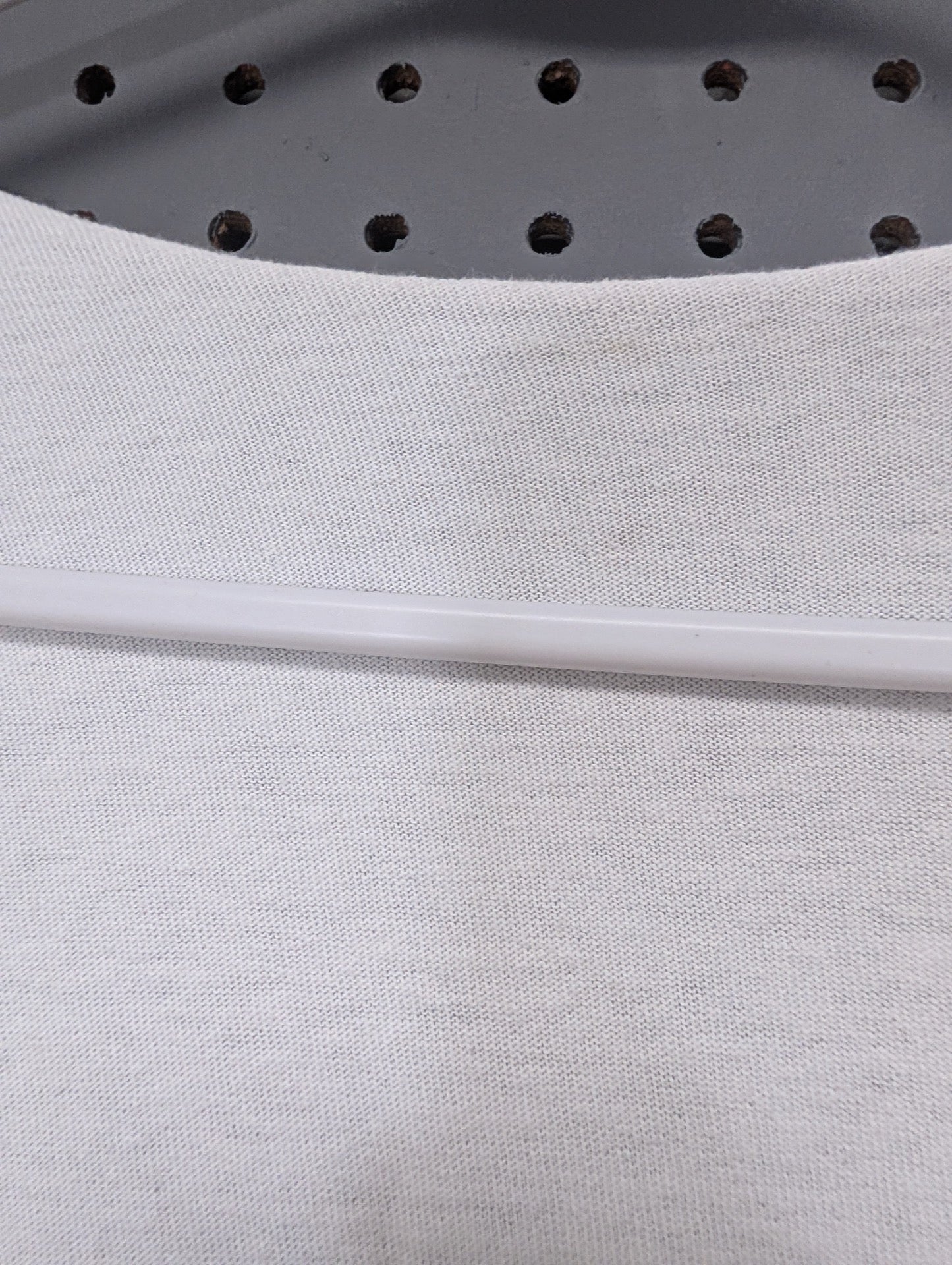 Detail of custom cut raw edge neckline