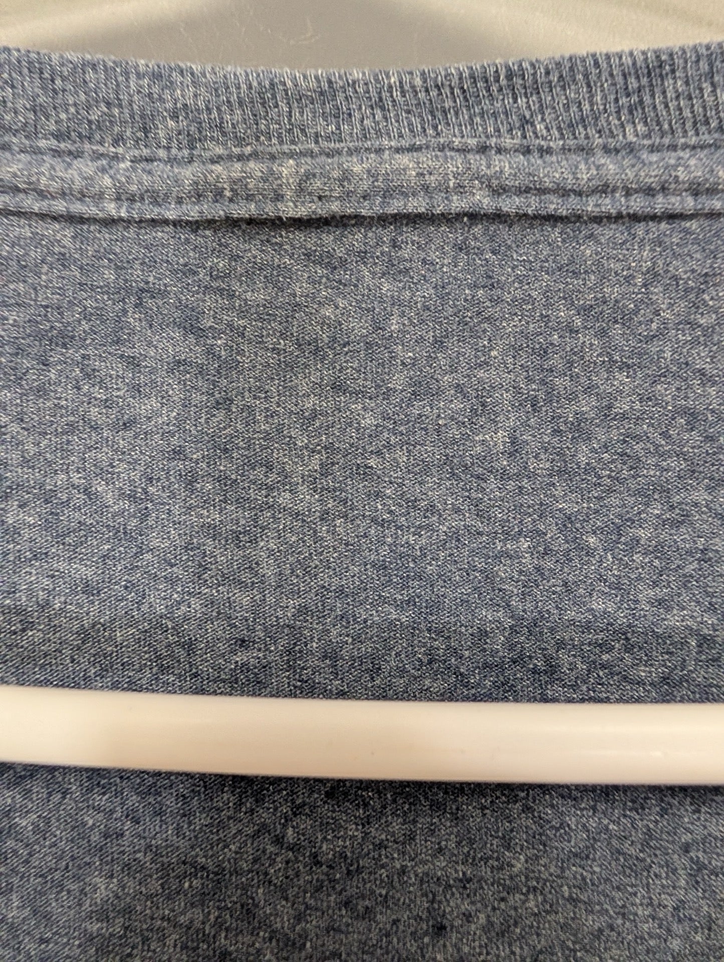Close up of blue heather fabric texture at collar