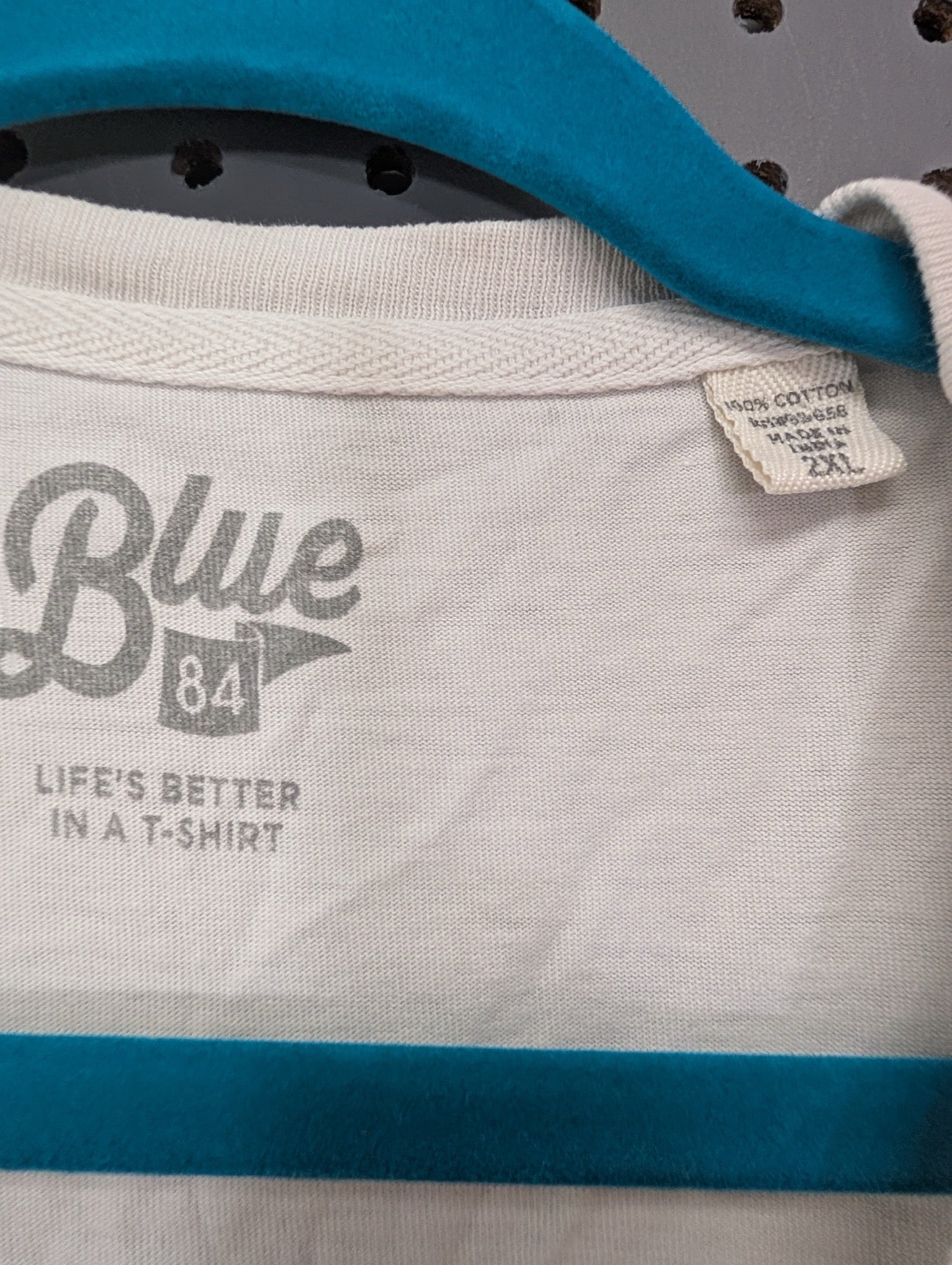 Blue 84 neck tag showing 2XL