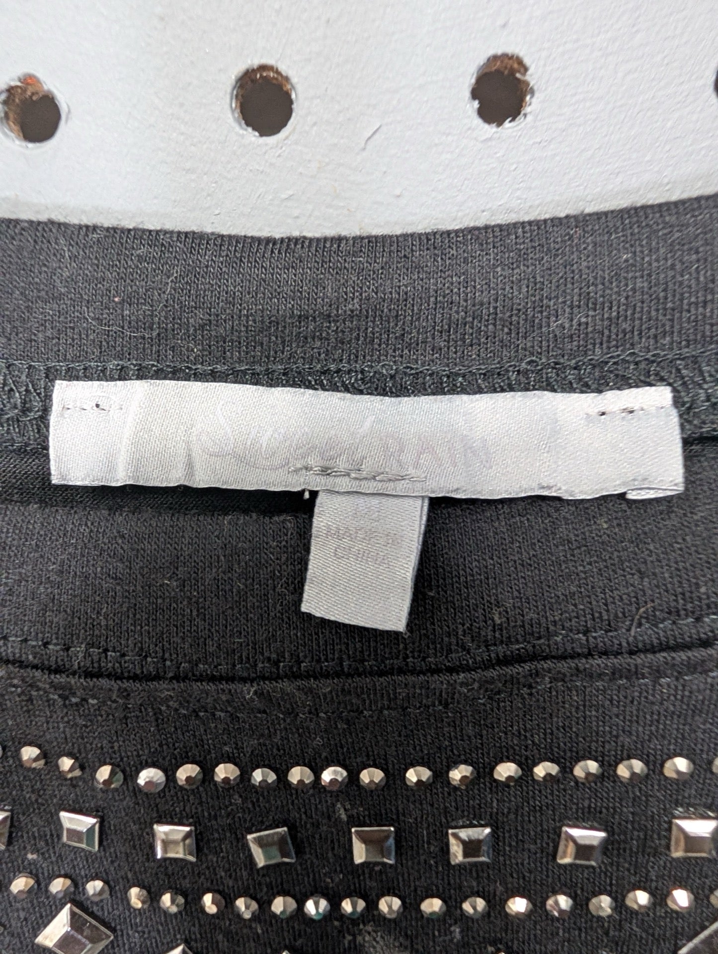 Faded brand tag for studded dress