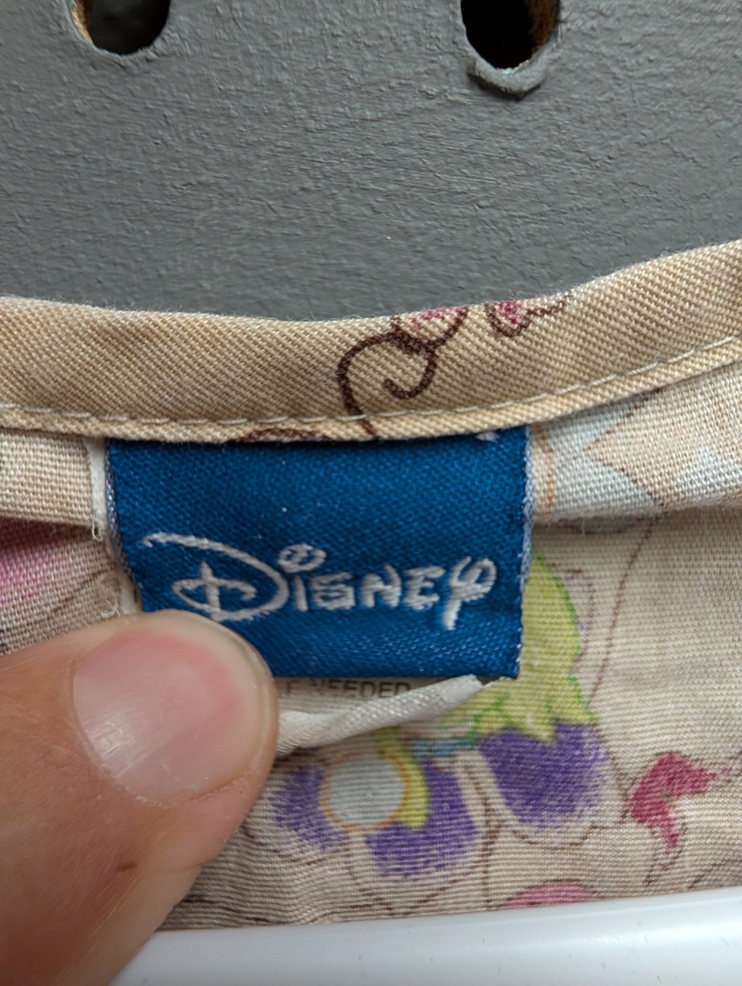 Close up of blue woven Disney tag