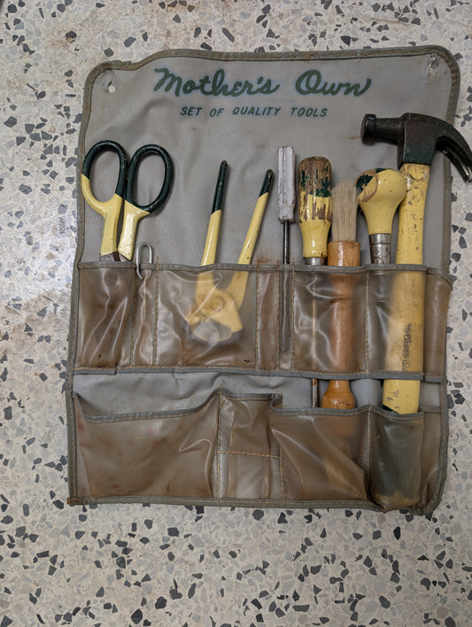 Pexto Mother's Own tool set in original display pouch. Screwdrivers, hammer, clippers, heavy duty scissors, awl, pliers, tape measure, and more! Handy vinyl compartmented case to keep everything organized. 15" X 13" X 1 1/2"