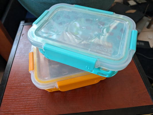 Two double partition glass storage containers