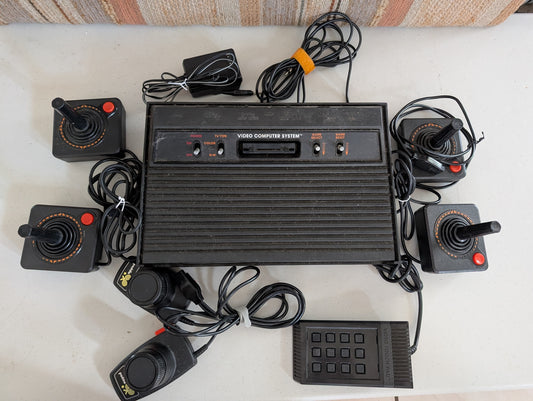 Vintage Atari 2600 CX2600A Console four joysticks paddles and keypad