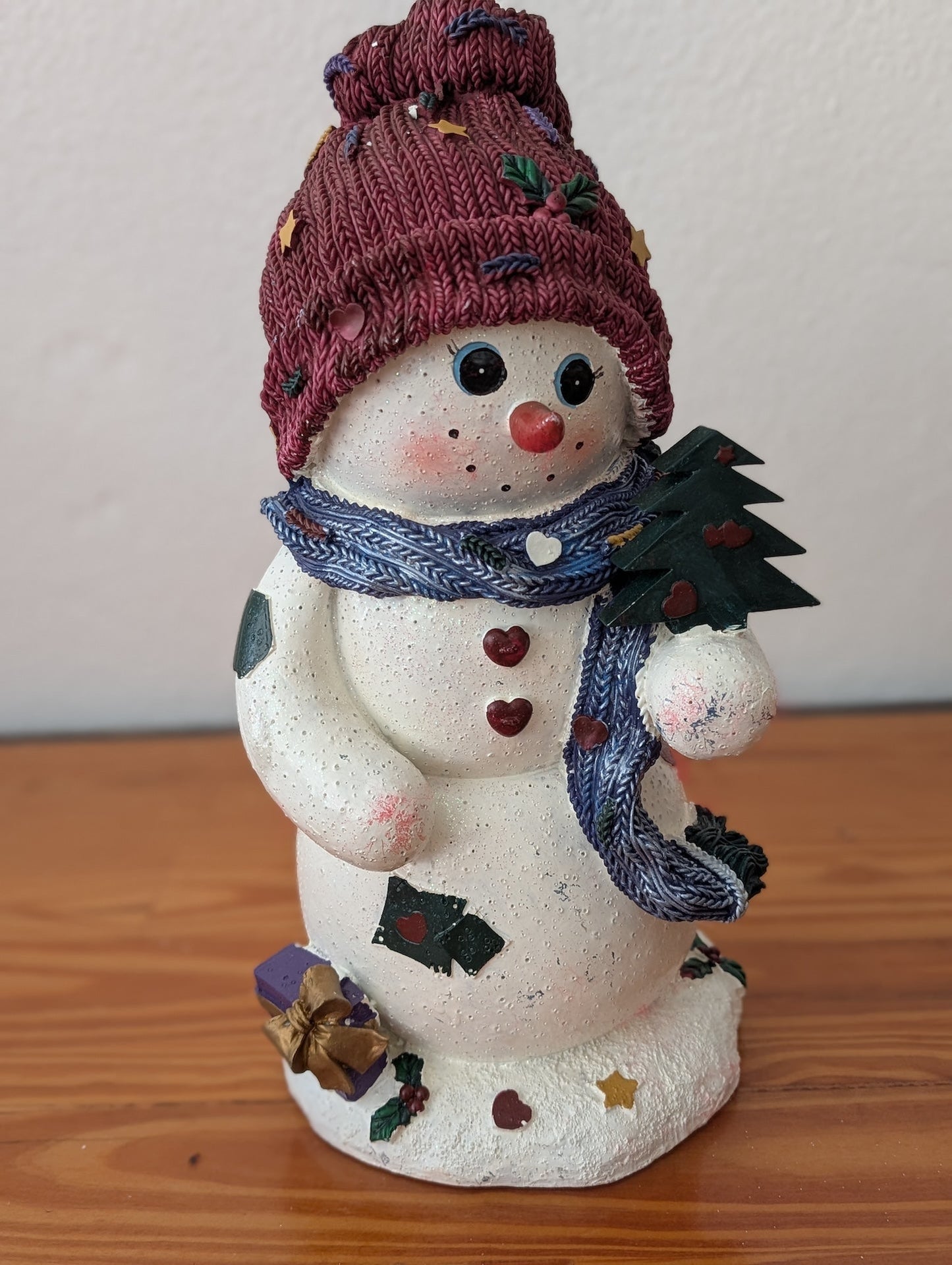 Snowman with Tree and Knit Hat from Unknown -  Holiday Decor (Resin Figurine, Whimsical, Collectible, White, Maroon, Blue)