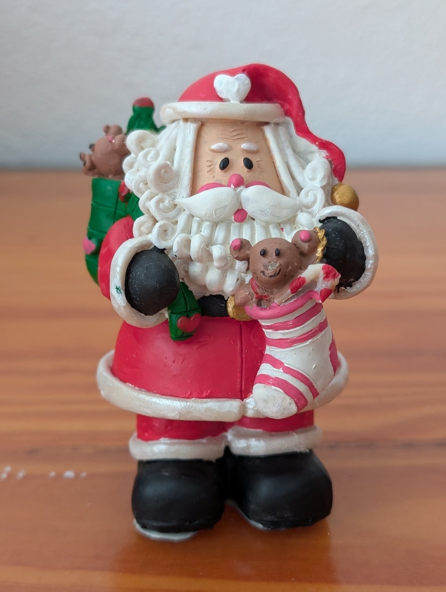 Santa with Toys Figurine from Unknown -  Holiday Decor (Resin Figurine, Traditional, Collectible, Red, White, Black)