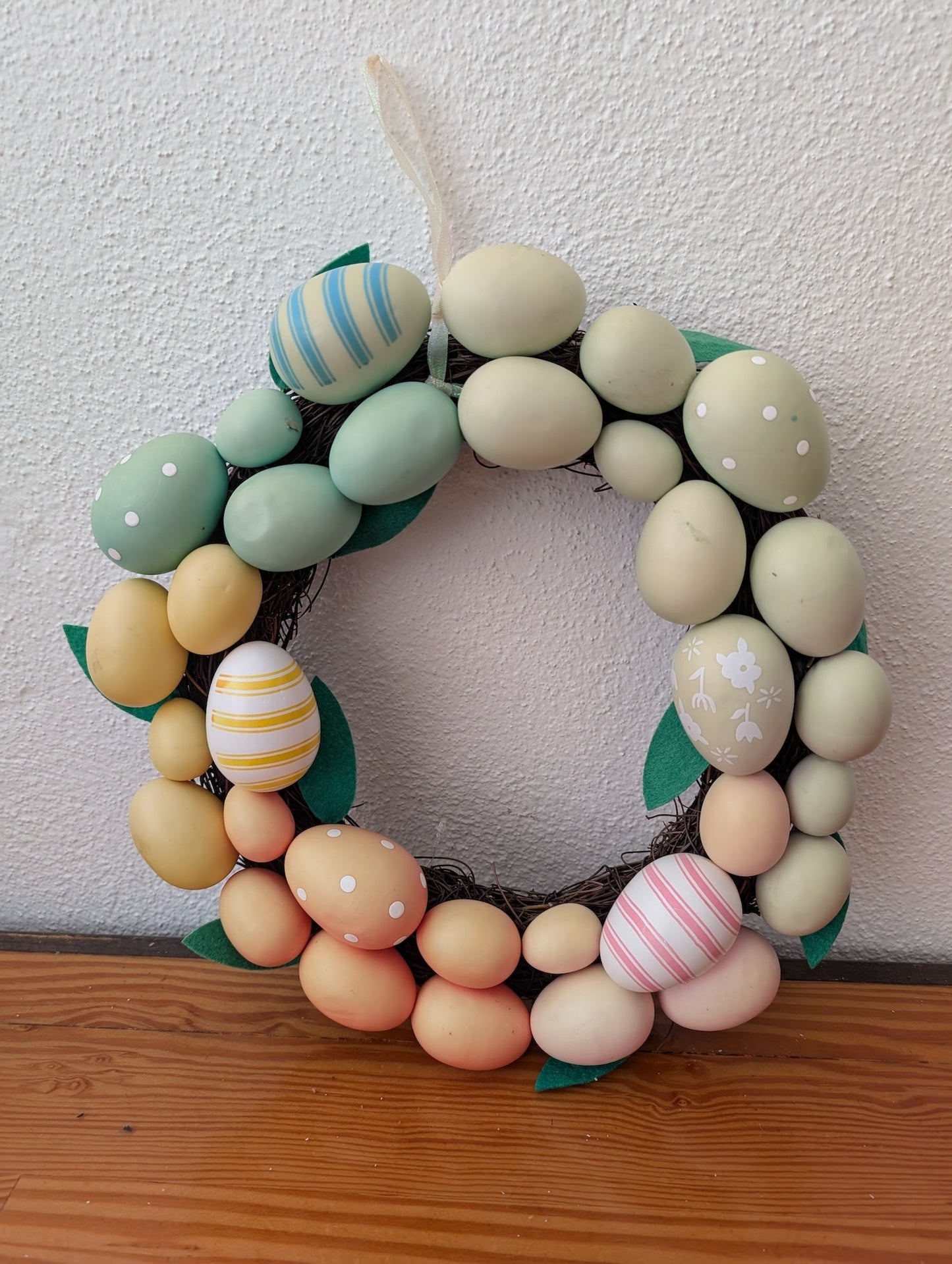 Easter Egg Wreath from Unknown -  Holiday Decor (Plastic, Grapevine, Felt Wreath, Easter, Farmhouse, Spring, Pastel Green, Blue, Yellow, Pink)