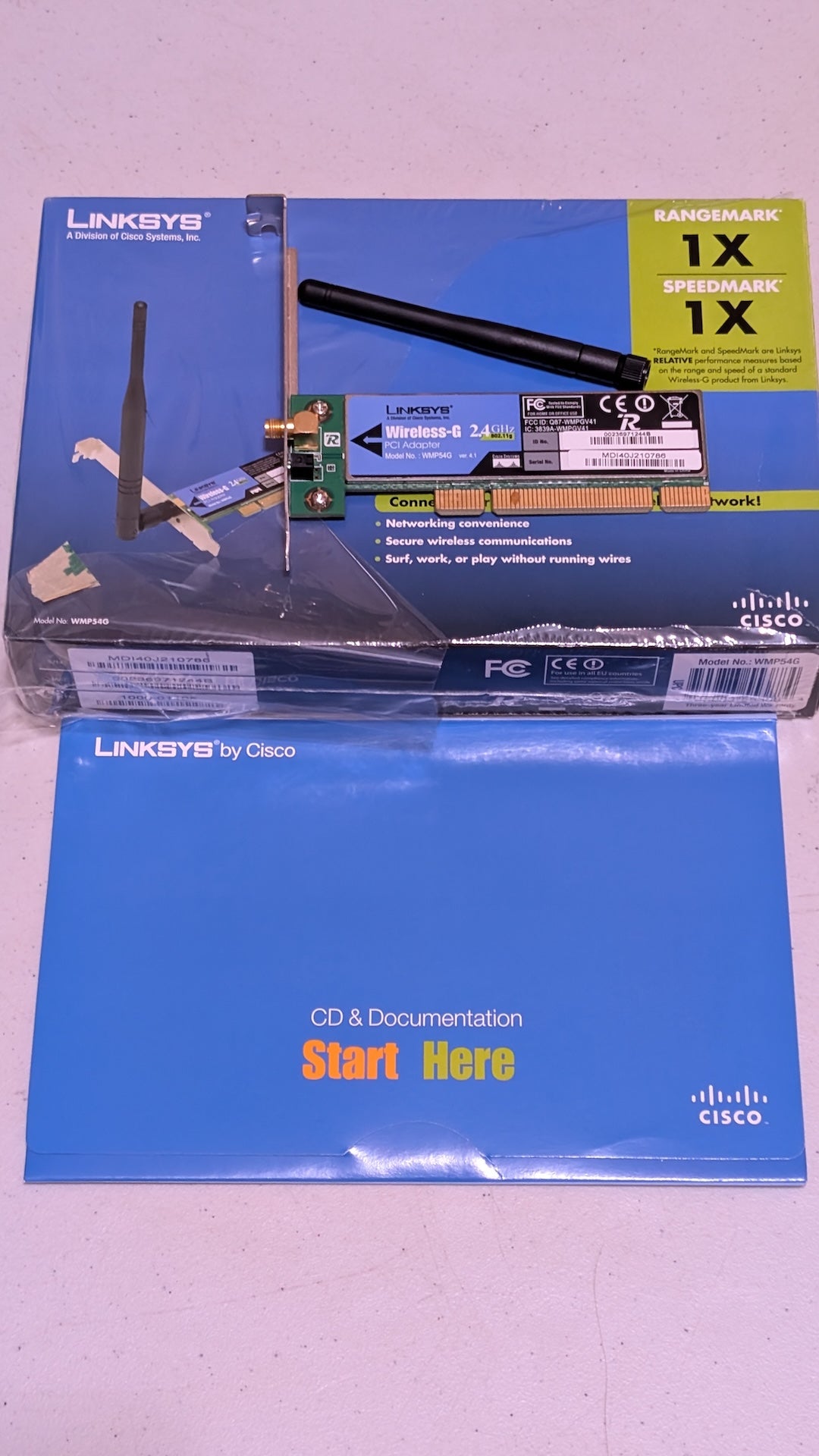 WMP54G from Linksys by Cisco - 2000s Computer Components (PCB, Plastic, Metal, Cardboard Network Adapter, Retro Tech, Blue, Black)