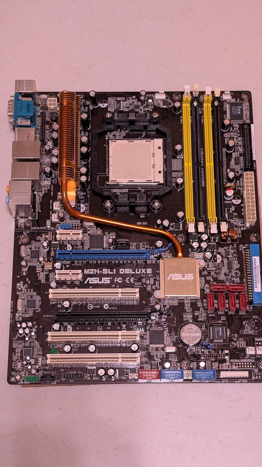 M2N-SLI DELUXE from ASUS - 2000s Computer Components (PCB, Copper, Metal, Plastic Motherboard, Retro Tech, Industrial, Black, Copper, Yellow, Blue)