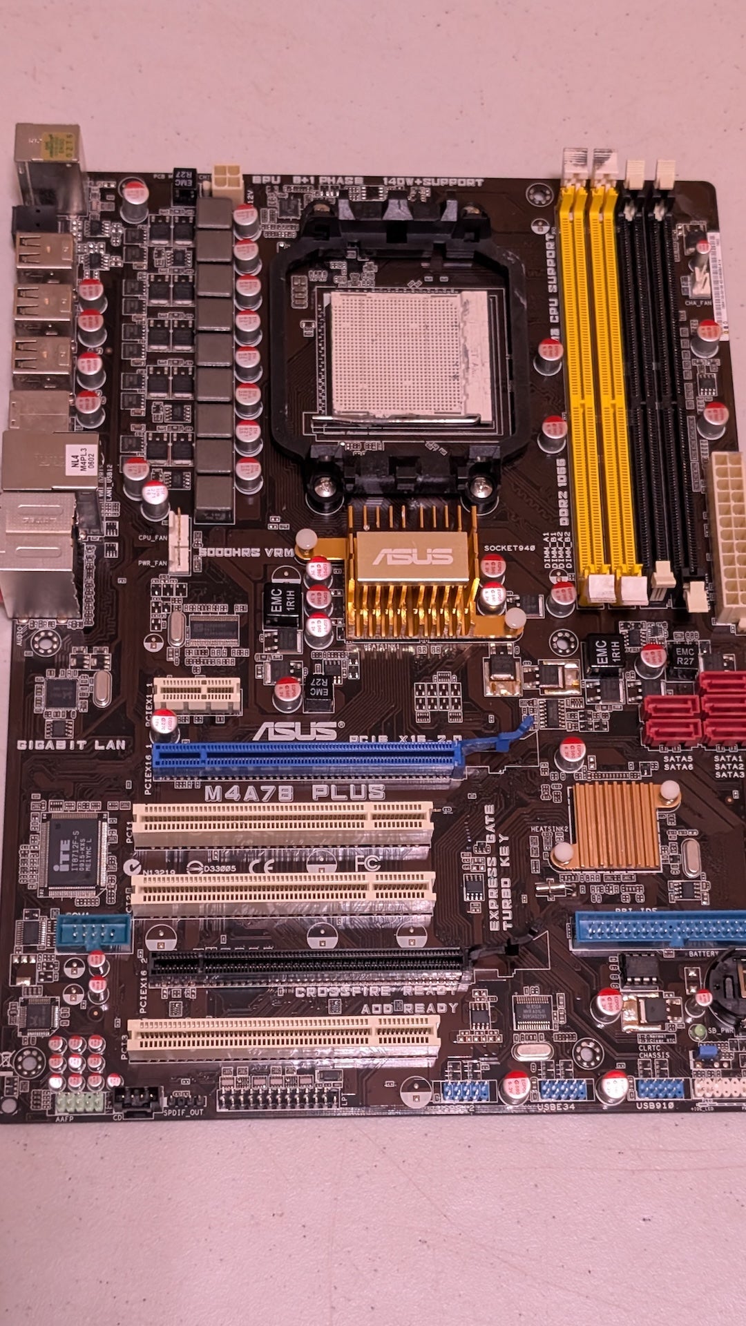 M4A78 PLUS from ASUS - 2000s Computer Components (PCB, Metal, Plastic Motherboard, Industrial, Brown, Black, Yellow, Gold)