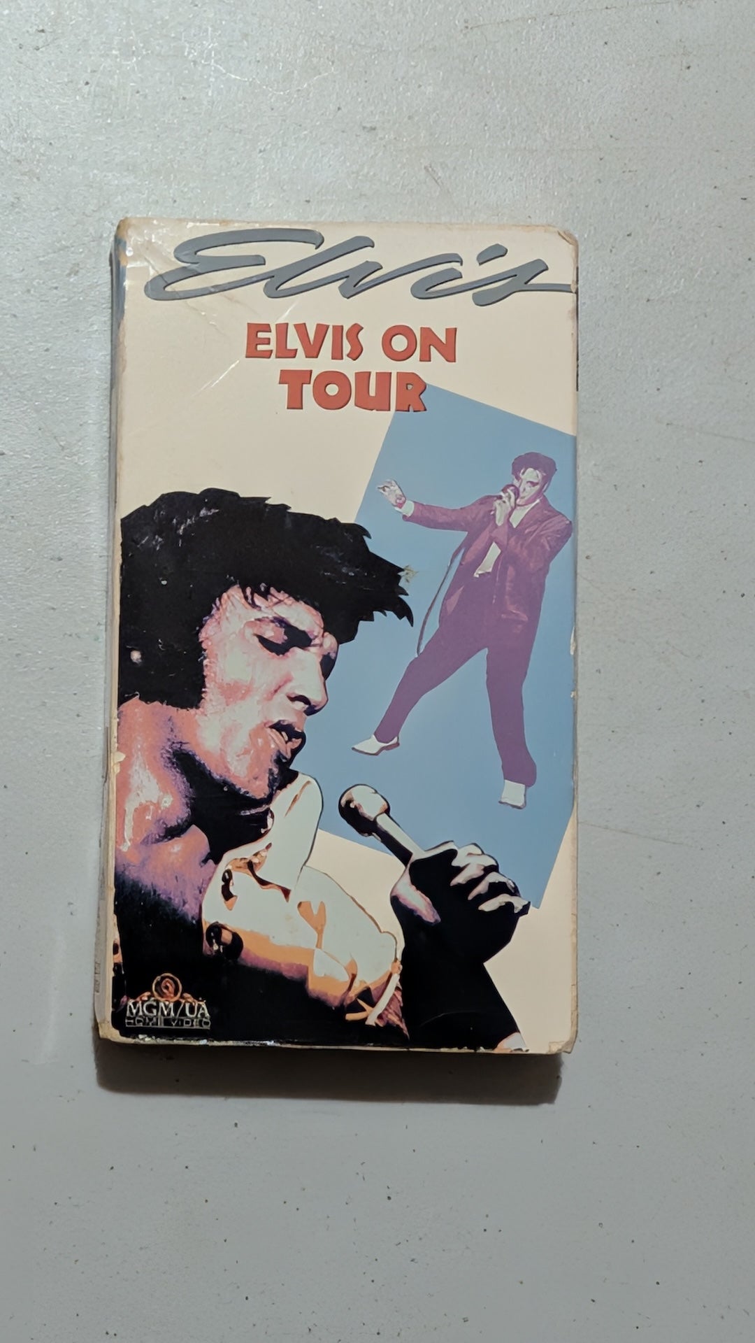 Elvis on Tour from MGM/UA Home Video - 1980s Media (VHS Cassette, Cardboard VHS Tape, Film Memorabilia, Retro, Cream, Red, Purple, Collectable, Vintage, Original)