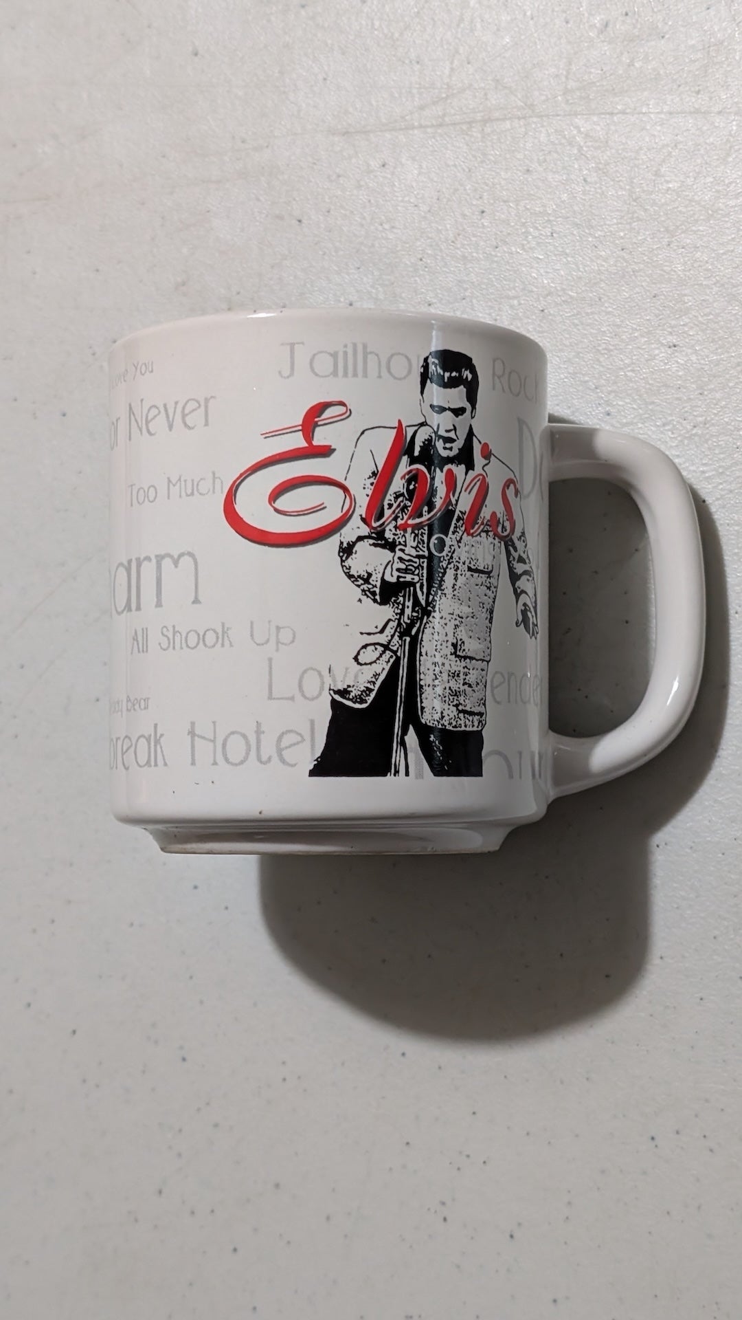 Elvis Presley Song Titles Mug from Unknown - 2000s Housewares (Ceramic Mug, Kitchenalia, Music Memorabilia, White, Black, Red, Gray, Collectable, Vintage, Original)