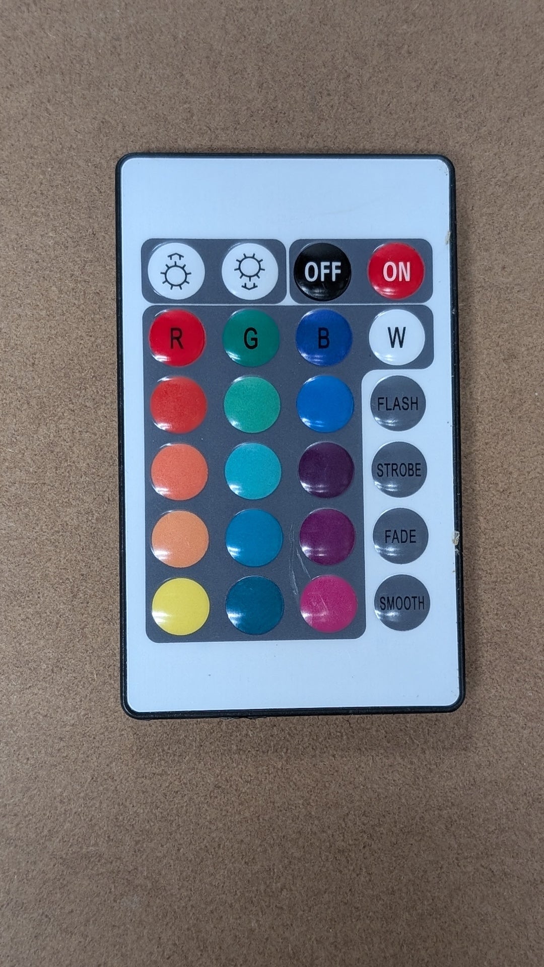 Remote from Unbranded - 2010s Electronics > Accessories > Remote Controls (Plastic, Rubber RGB LED Remote, Minimalist, White, Black)