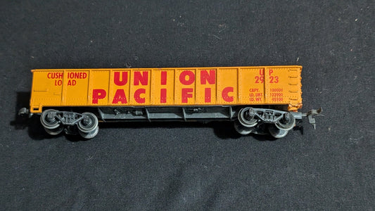 Union Pacific Cushioned Load Boxcar Boxcar likely from Tyco/Life-Like - 1970s HO Scale Model Train (Plastic, Metal Boxcar, Not Applicable, Yellow, Red)