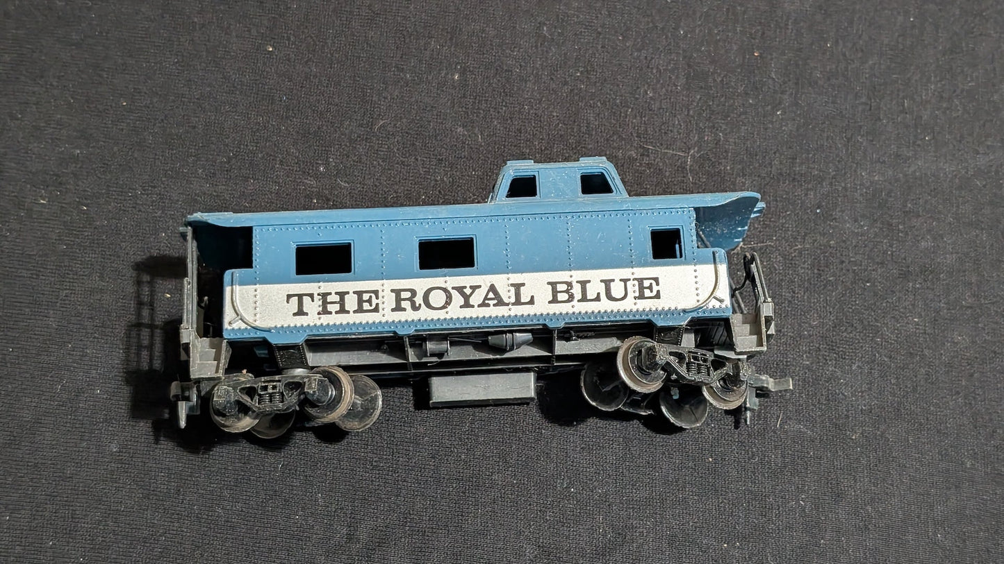 The Royal Blue Caboose Caboose likely from Tyco - 1970s HO Scale Model Train (Plastic, Metal Caboose, Not Applicable, Blue, White)