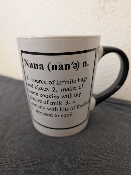 White ceramic mug with a black handle and a printed dictionary definition of the word Nana.