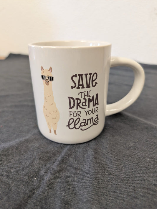 White coffee mug featuring a cartoon llama wearing sunglasses and text Save the Drama for Your Llama.