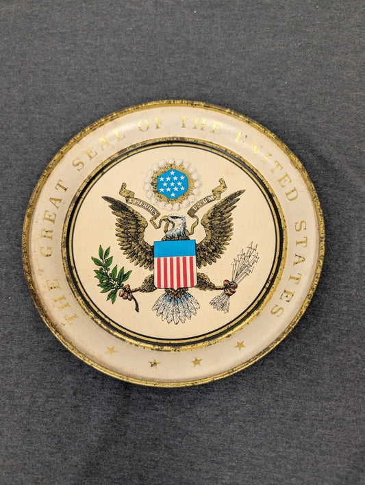 Tin decorative plate featuring the Great Seal of the United States bald eagle design.