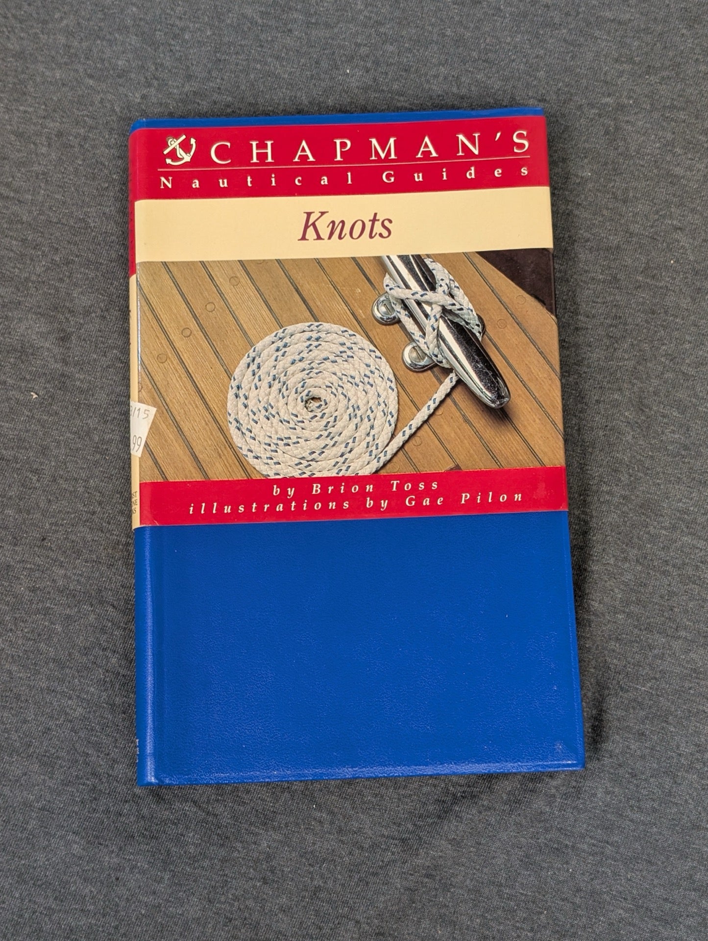 Cover of Chapman's Nautical Guides: Knots showing a neatly coiled rope on a boat deck.