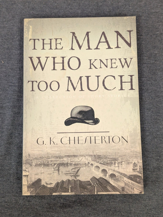 Cover of The Man Who Knew Too Much by G.K. Chesterton showing a bowler hat over London.