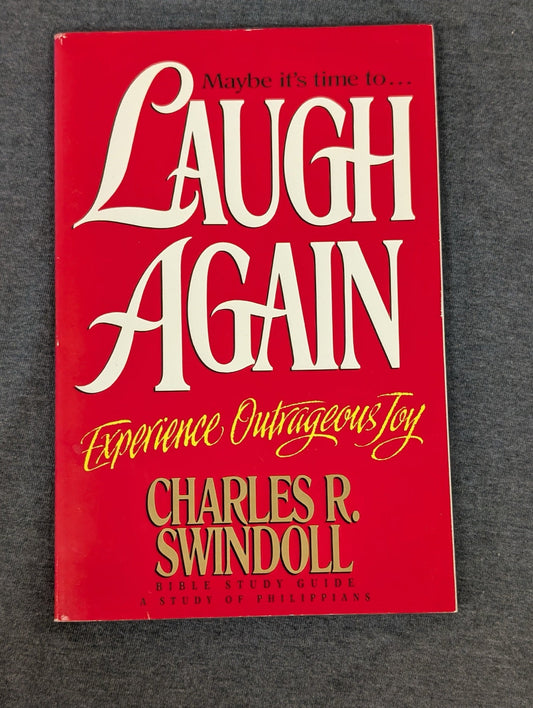 Bright red cover of the book Laugh Again Experience Outrageous Joy by Charles R. Swindoll.