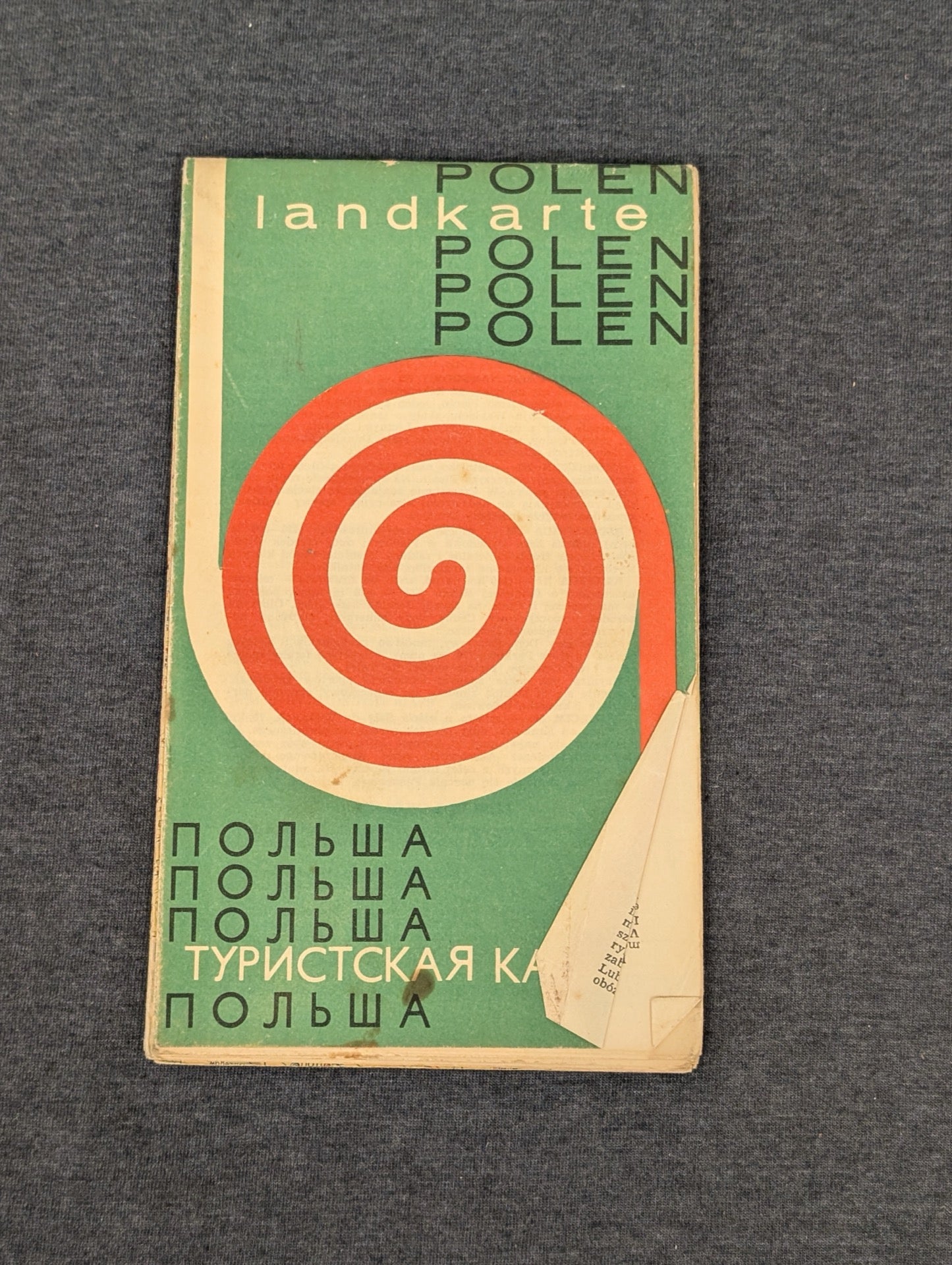 Vintage Polska tourist map with red spiral graphic on green background.