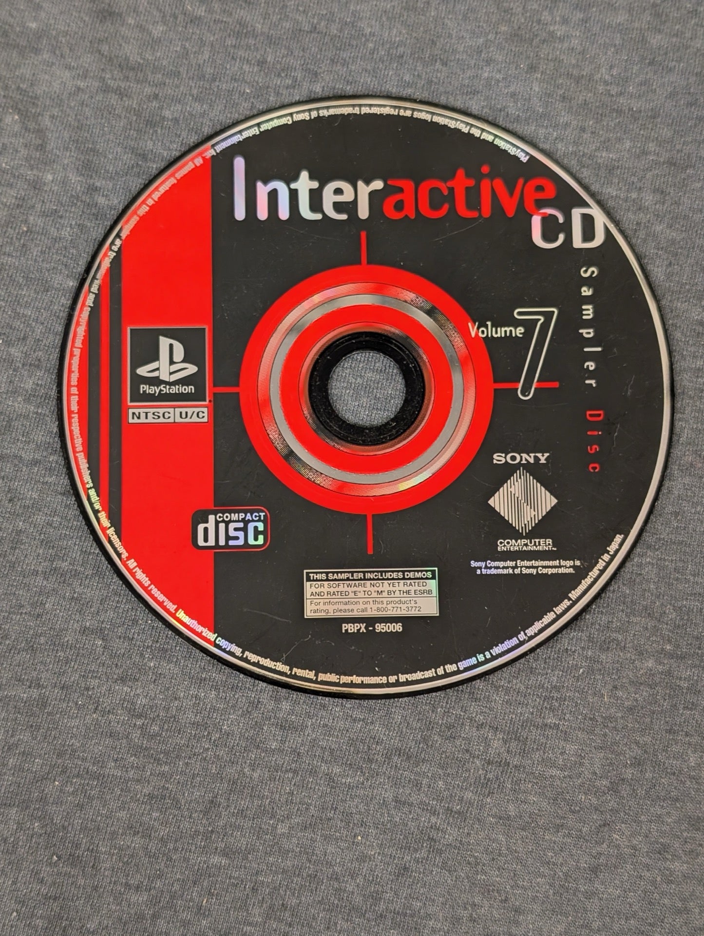 PlayStation Interactive CD Sampler Disc Volume 7 black and red disc
