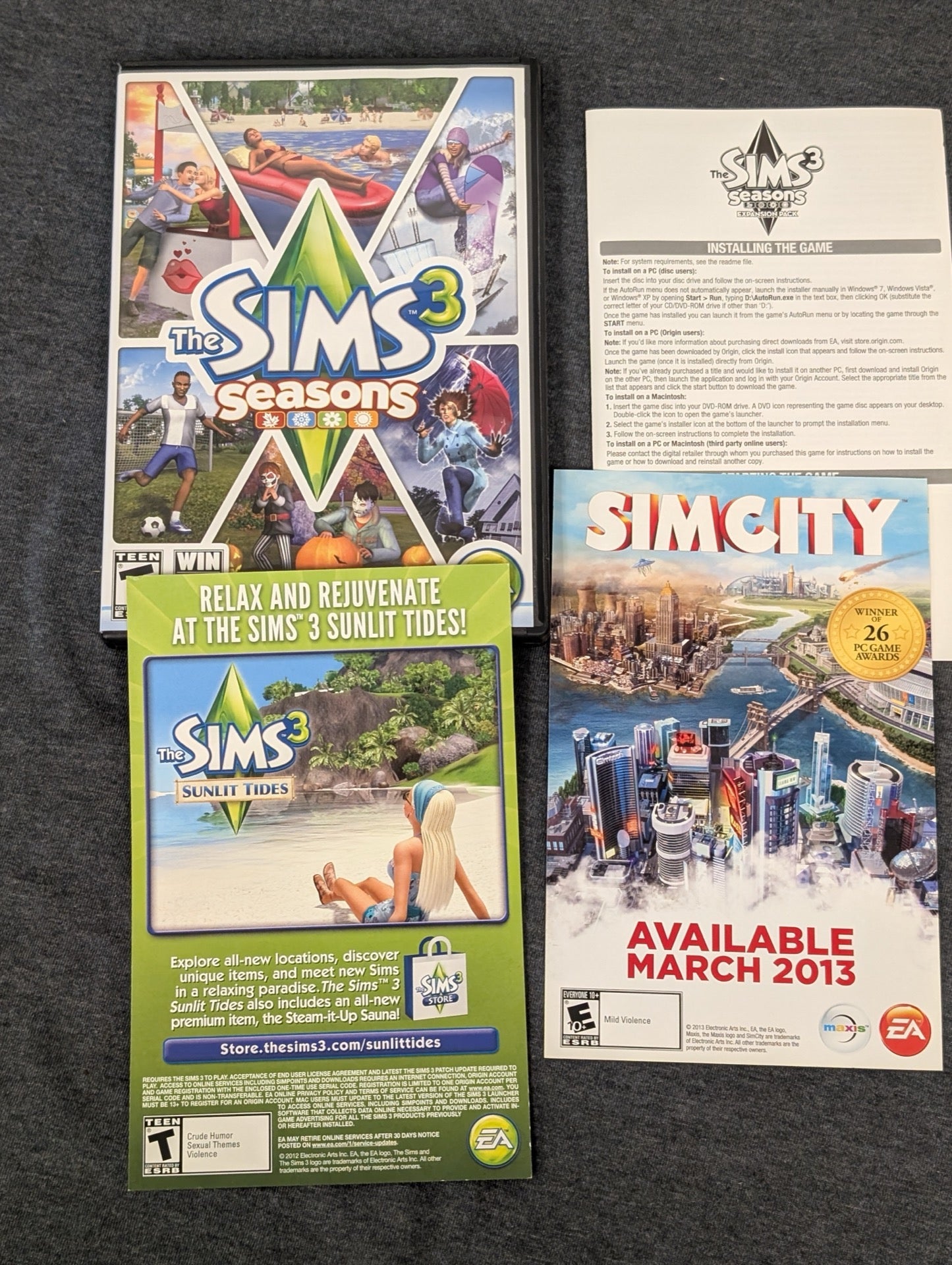The Sims 3 Seasons empty PC game case with original promotional inserts. No game included.
