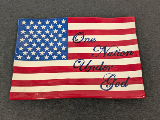 Rectangular ceramic tray painted like an American flag with text One Nation Under God.