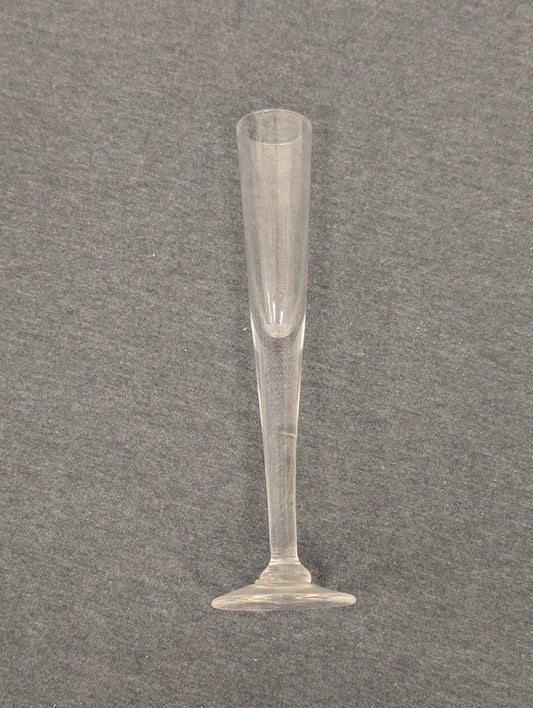 Sleek vintage clear glass champagne flute with a conical bowl.