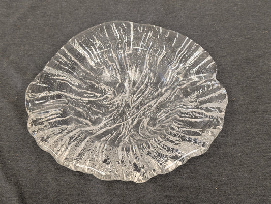 Clear glass plate with a heavy, rugged texture and uneven freeform edges.
