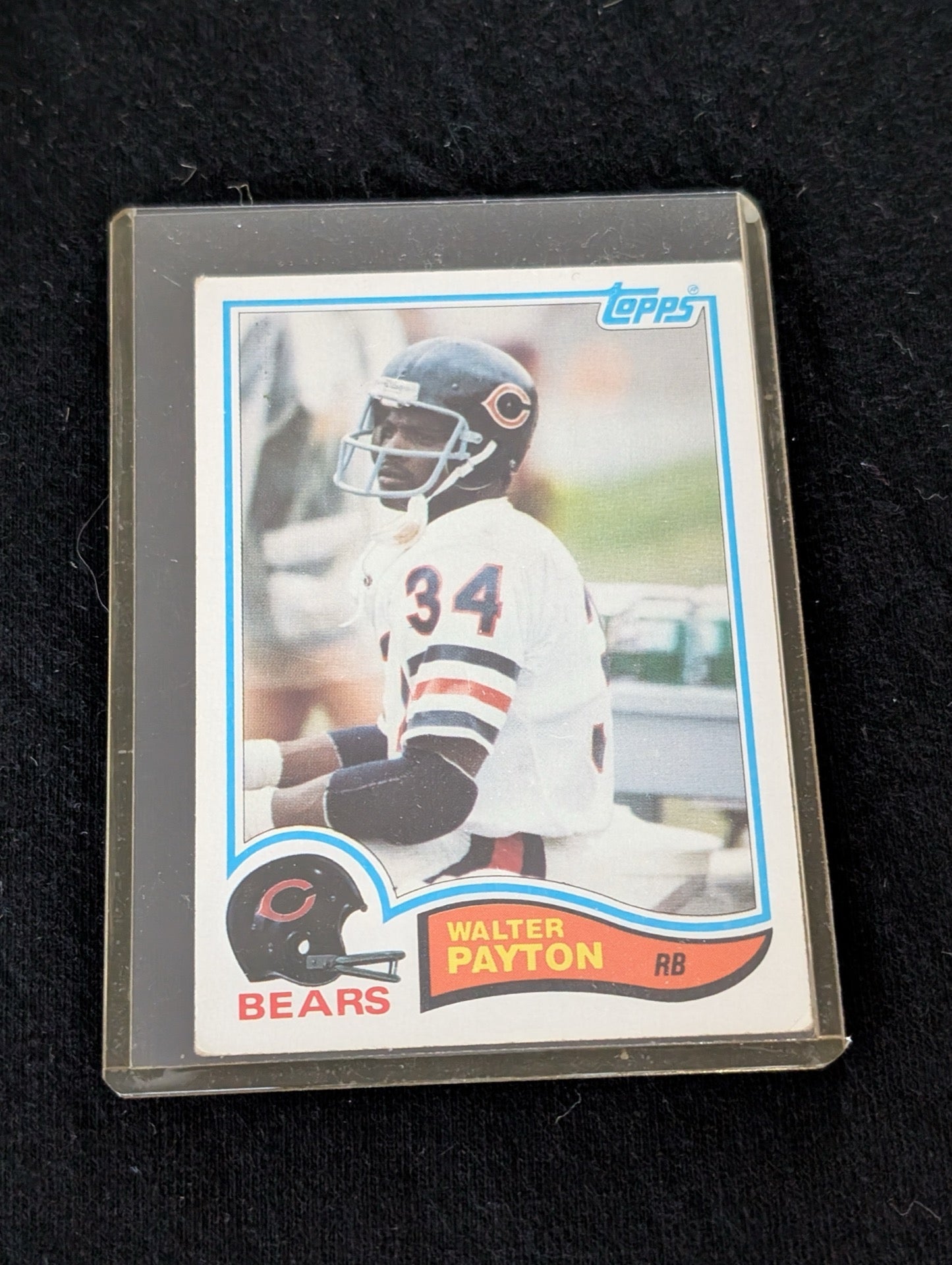 1976 Topps Walter Payton #148 Rookie Card Chicago Bears in protective case.