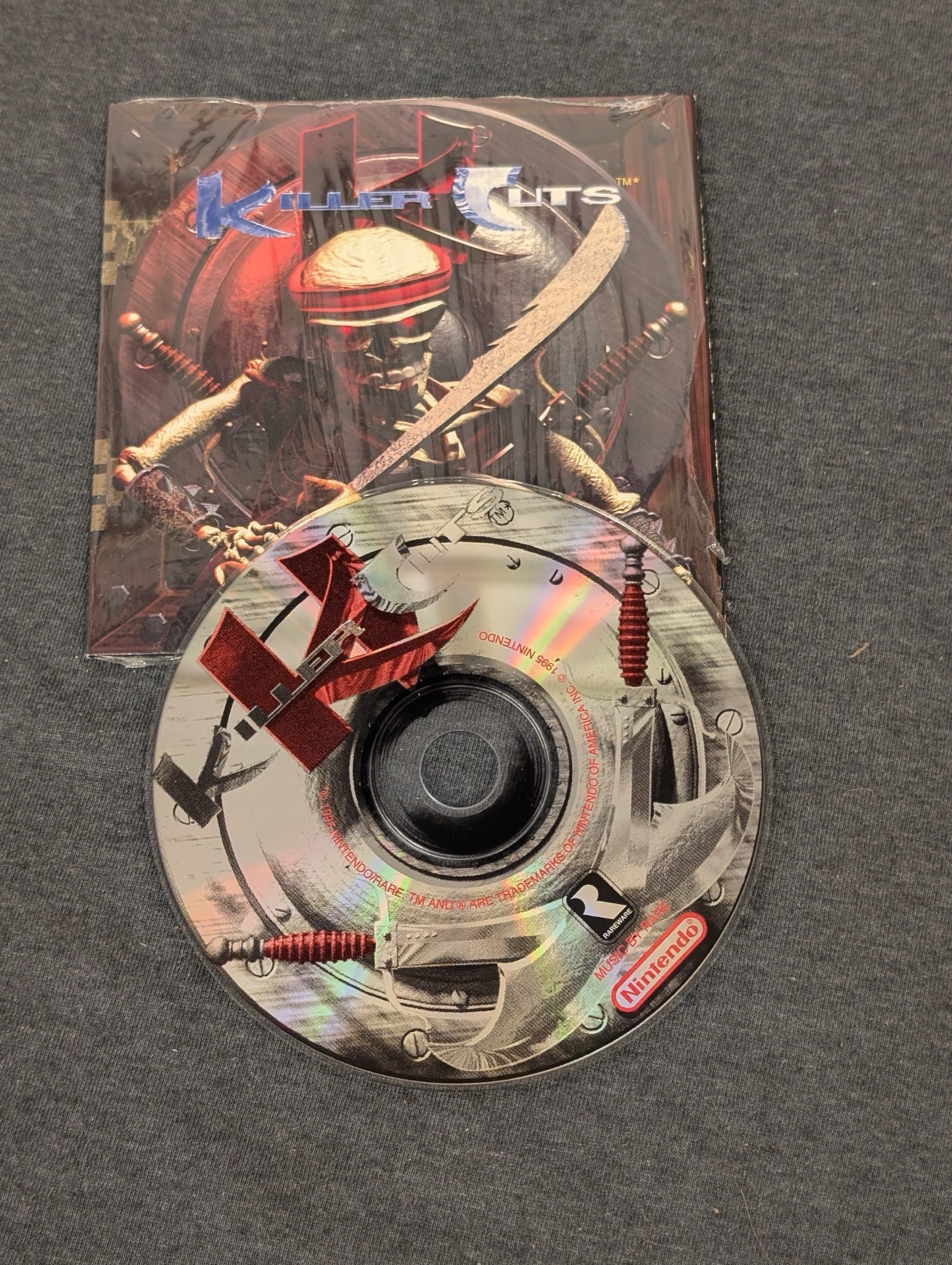 Killer Cuts CD disc and booklet featuring a skeleton warrior