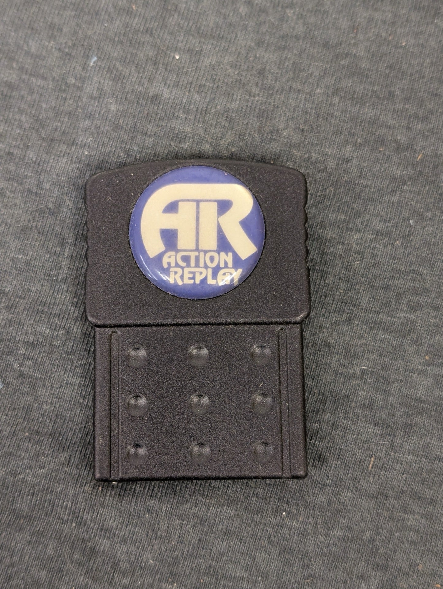 Black Action Replay PlayStation 1 memory card with blue logo