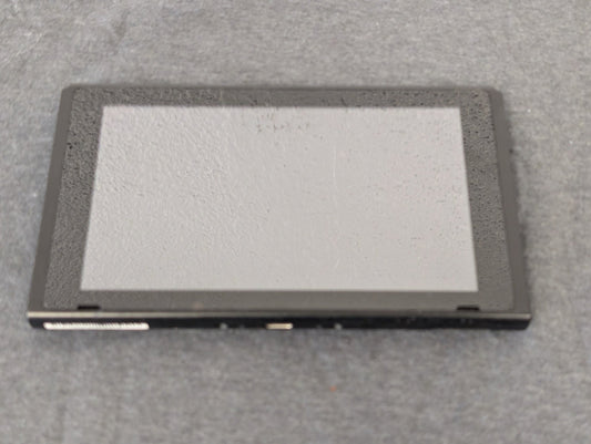Front of a Nintendo Switch tablet screen showing heavy wear