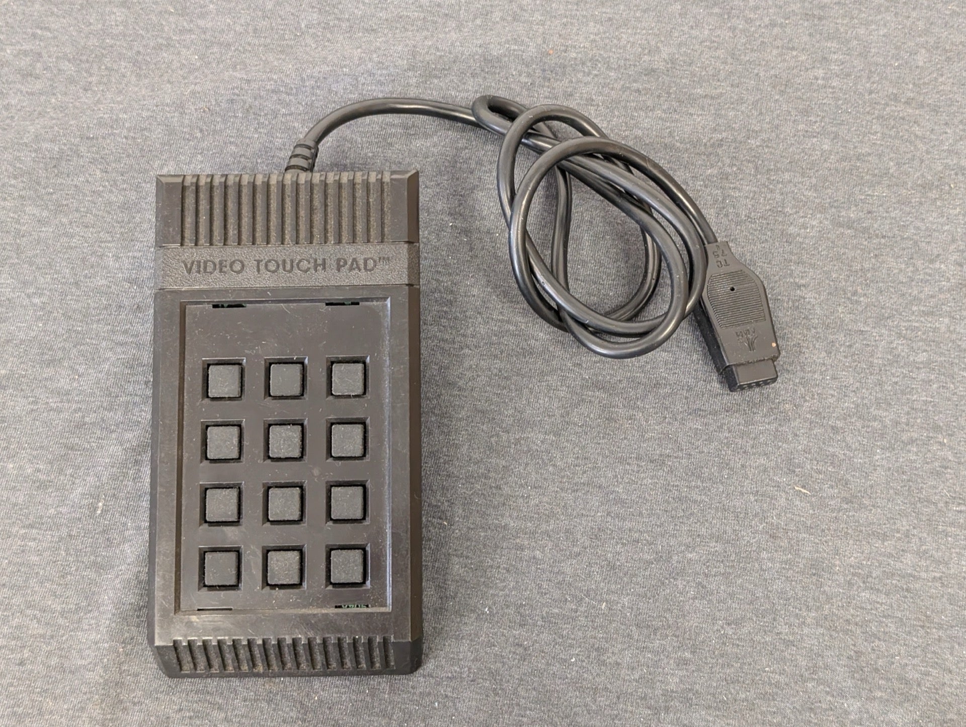 Rectangular black Atari Video Touch Pad keypad controller.