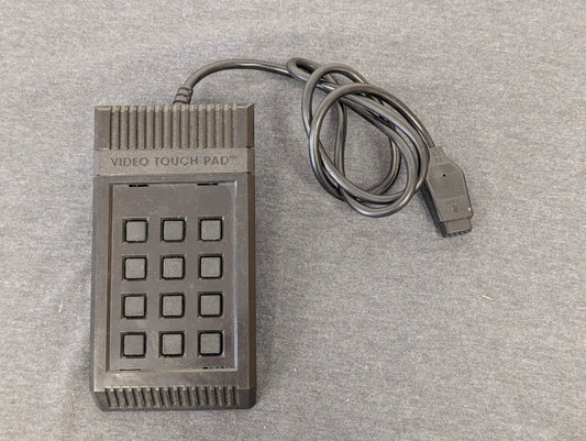 Rectangular black Atari Video Touch Pad keypad controller.